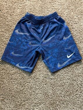 Nike Blue Athletic Shorts with White Swoosh Pattern